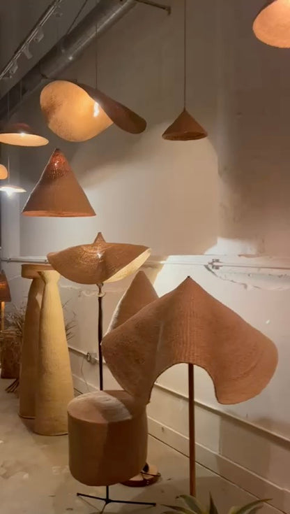 Showing many Twenty One Tonnes handwoven, natural colored light shades together.