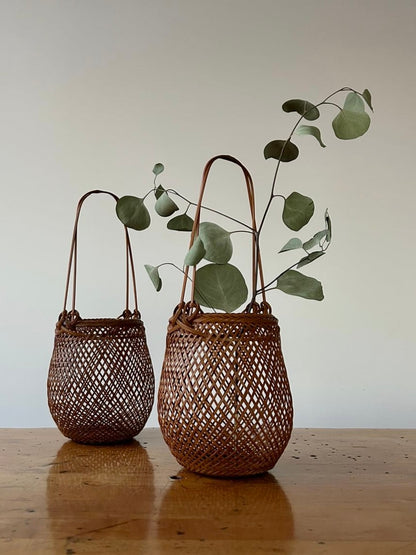 Two small smoked bamboo baskets handcrafted and hand woven by Japanese artist Mie Kodama.