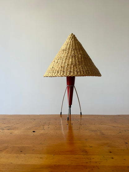 A vintage tripod table lamp from the Netherlands circa 1950s in the iconic midcentury space-age style. Burgundy/red colored wood and metal base in good vintage condition.