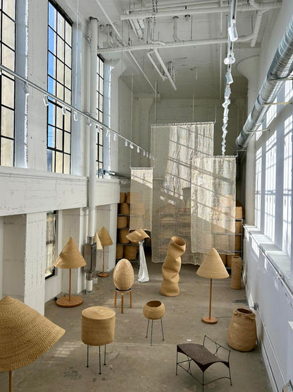 Twenty One Tonnes studio, showing hand woven baskets and lamp shades.