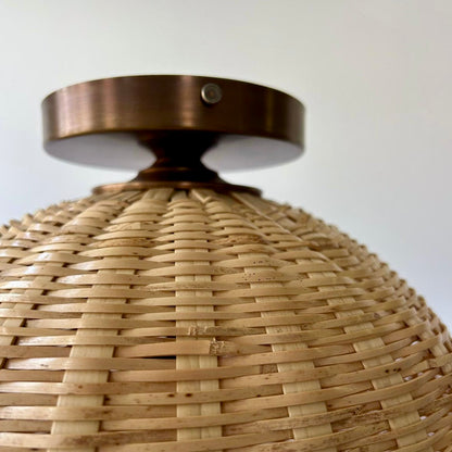 Showing the top of the hand woven Brava light's flush ceiling mount.