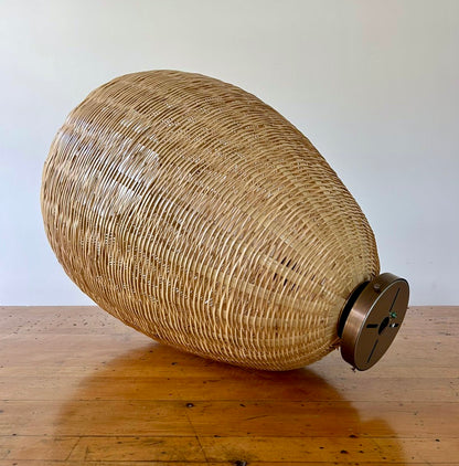 The Brava Light is a large, hand-woven, egg-shaped, ceiling-mounted pendant light, made from a bamboo-like river reed by skilled craftspeople in Oaxaca, Mexico. A perfect light for kitchens, hallways, and living rooms. 