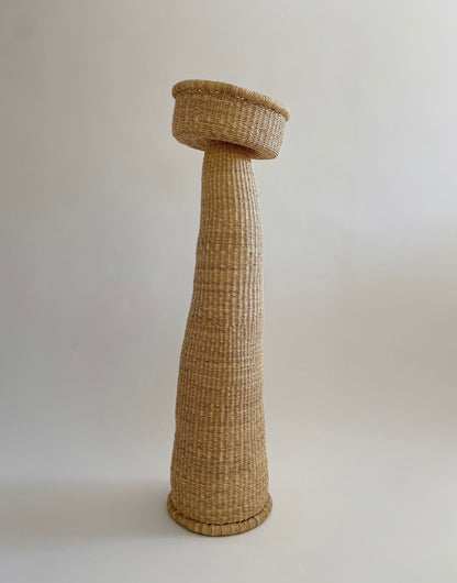 A large woven sculpture handcrafted from African elephant grass.