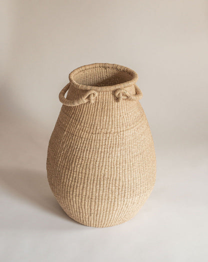 Large garlic shaped gourd basket, handwoven with two handles. Made in Ghana from local sustainable grass.