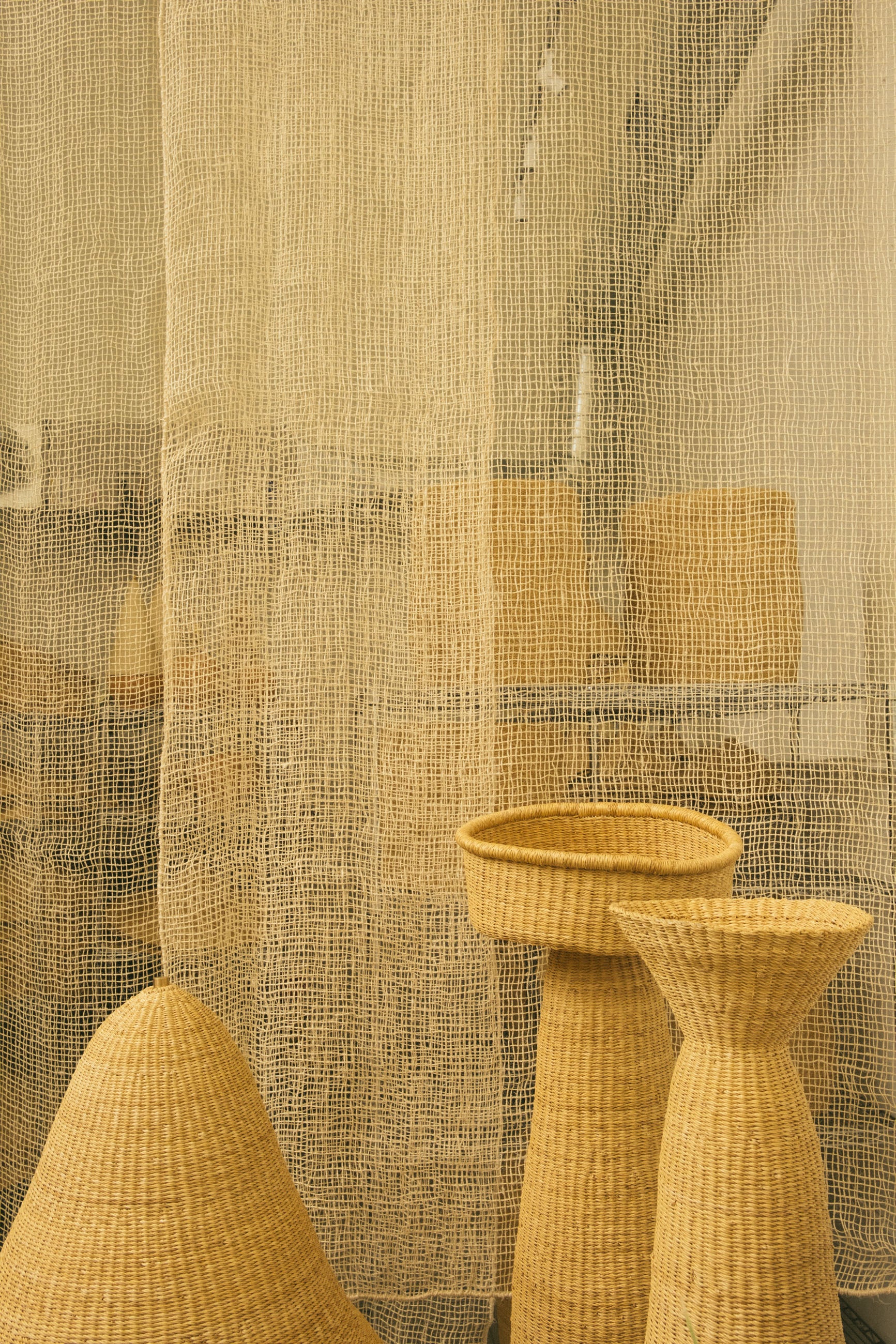 The Cortina Maguey is a handwoven sheer textile hanging. It's made in Oaxaca, Mexico, from the leftover maguey leaves from mezcal production. These natural colored curtains make beautiful room dividers, window coverings or wall hangings, and can be custom made to any size.