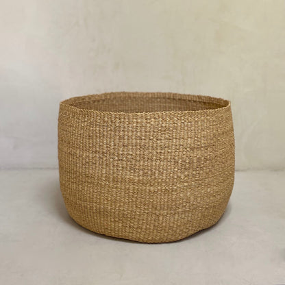 Large hand woven storage basket. Made in Ghana from local, natural-colored, sustainable materials.