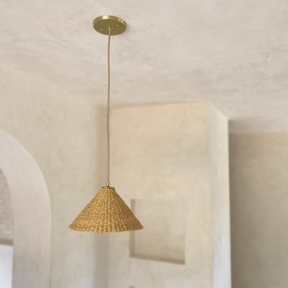 Our Bonnet pendant lights are a conical shape, handwoven from natural colored, indigenous elephant grass by members of a women’s organization in northern Ghana. A perfect-sized pendant for any room or living space.