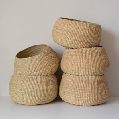 twenty one tonnes small basket storage. Small handwoven baskets made from natural colored elephant grass, from northern Ghana.