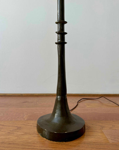 The base of an iron vintage floor lamp.