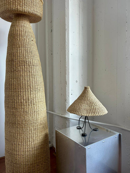 Modernist, iron table lamp from France circa 1950s. Paired with a coned shaped hand woven lamp shade.