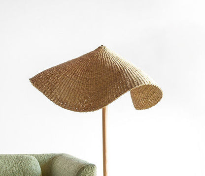 Woven light shade on floor lamp.