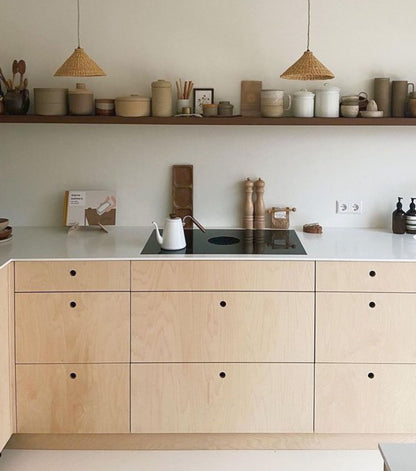 Our Bonnet light shades over a kitchen counter. These natural colored, conical shaped shades are perfect for bedrooms, hallways, kitchens and living spaces.