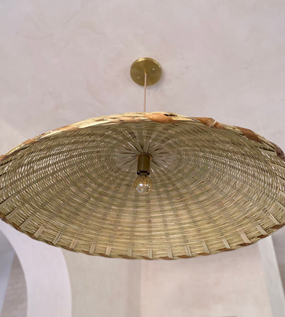 The Carrizo Pendant Light is a hand-woven, upside-down dish-shaped pendant light, made from a natural colored, bamboo-like river reed by skilled craftspeople in Oaxaca, Mexico. An ideal pendant for any space where you wish to have a warm downward light.