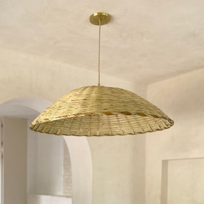 The Carrizo Pendant Light is a hand-woven, upside-down dish-shaped pendant light, made from a natural colored, bamboo-like river reed by skilled craftspeople in Oaxaca, Mexico. An ideal pendant for any space where you wish to have a warm downward light.