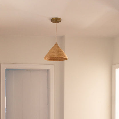 Our Bonnet pendant lights are a conical shape, handwoven from natural colored, indigenous elephant grass by members of a women’s organization in northern Ghana. A perfect-sized pendant for any room or living space.