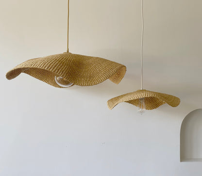 Two Fawn light shades are handwoven from sustainable elephant grass in Ghana. Their wide and floating shape are striking in any living space, especially in bedrooms or over dining tables.