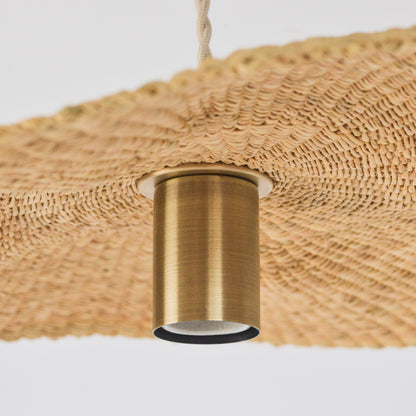 Showing the inside, hand woven texture of the Sunhat pendant light, and its pendant lighting fixture.