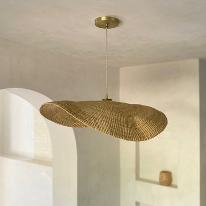 Our Fawn pendant lights are handwoven from natural colored elephant grass in northern Ghana.  Their wide and floating shape is striking in any living space, especially over a dining table or kitchen island.