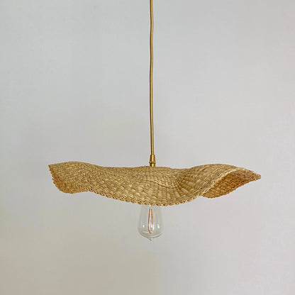 Our Fawn light shades are handwoven from sustainable elephant grass in Ghana. Their wide and floating shape are striking in any living space, especially in bedrooms or over dining tables.