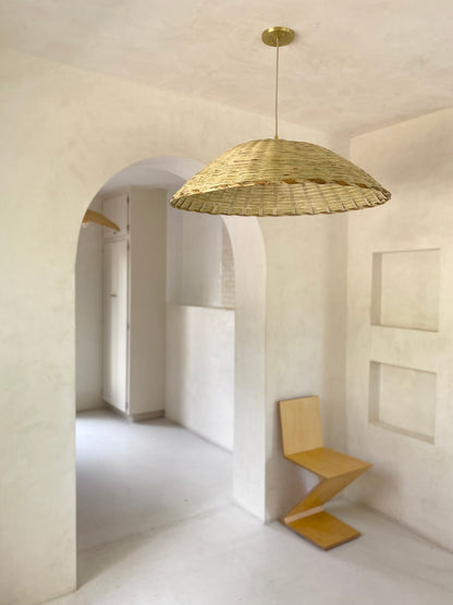 The Carrizo Pendant Light is a hand-woven, upside-down dish-shaped pendant light, made from a natural colored, bamboo-like river reed by skilled craftspeople in Oaxaca, Mexico. An ideal pendant for any space where you wish to have a warm downward light.