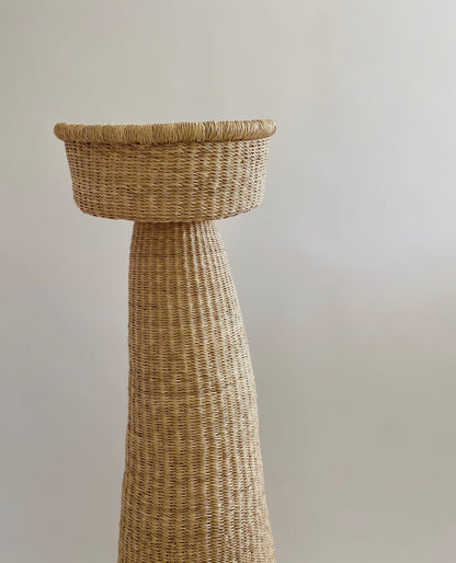 Hand woven installation made from natural materials.