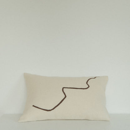 Cream rectangular cushions with a single brown squiggle line pattern.