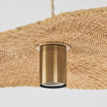 Showing the inside, hand woven texture of the Fawn pendant light shade and pendant fixture.