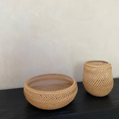 Two woven bamboo baskets, handcrafted and hand woven by Japanese artist Mie Kodama.