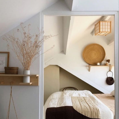 Handwoven round tray in a bedroom.